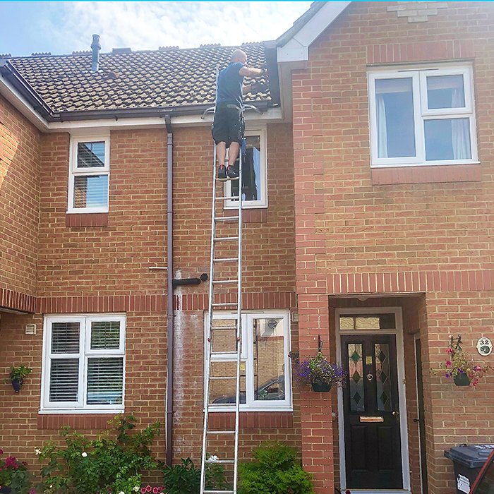 Gutter repairs in Brookwood, fitting a new bracket and re-hanging a sagging uPVC gutter